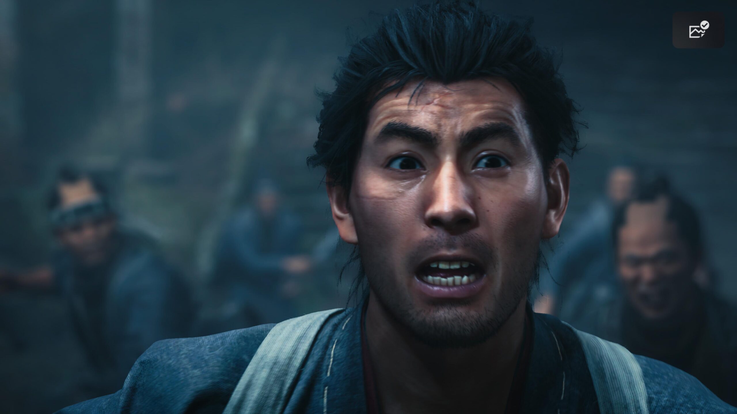 目と口を大きく開いた宮本武蔵の表情のアップ